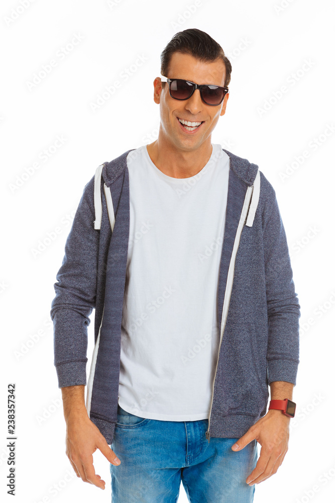 Joyful positive man being in a wonderful mood Joyful positive man being in a wonderful mood