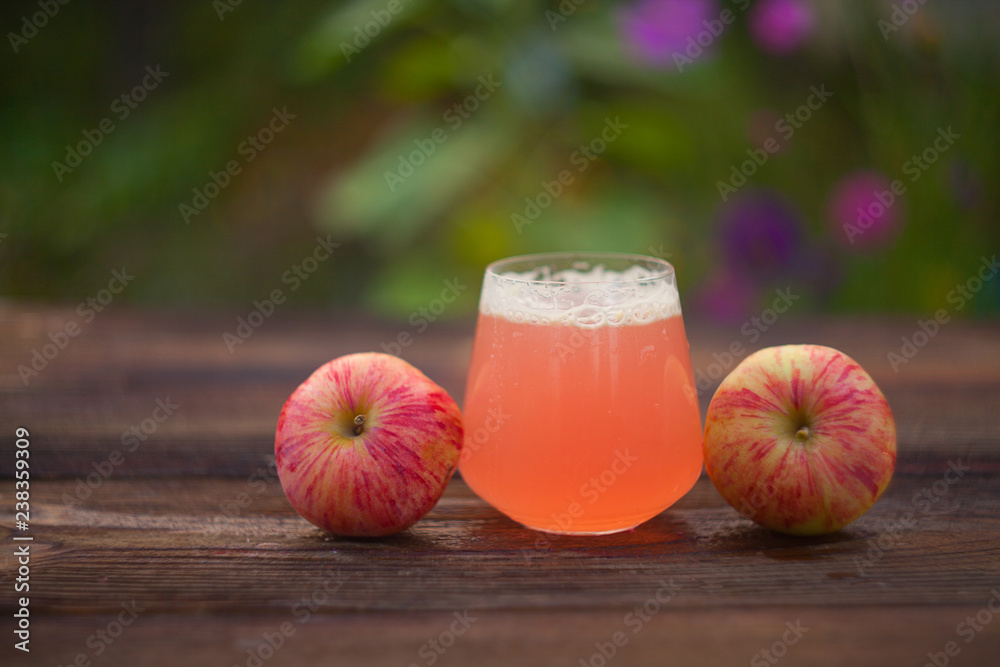 Delicious fresh squeezed apple juice in transparent glass Stock Photo |  Adobe Stock