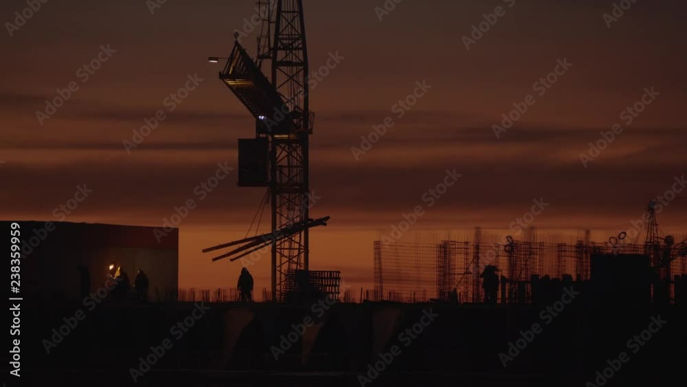 Builders on the top floor of a house under construction