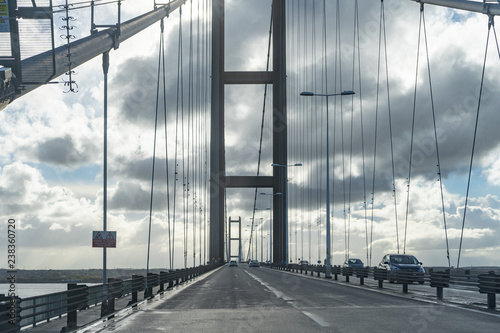 Street view on the bridge. Dramatic clouds over a big bridge. © Oktawiusz
