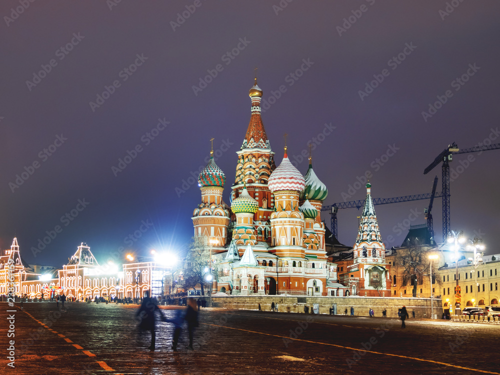 Famous landmarks - St. Basil Cathedral on Red square in Kremlin. Winter evening in Moscow, Russia.