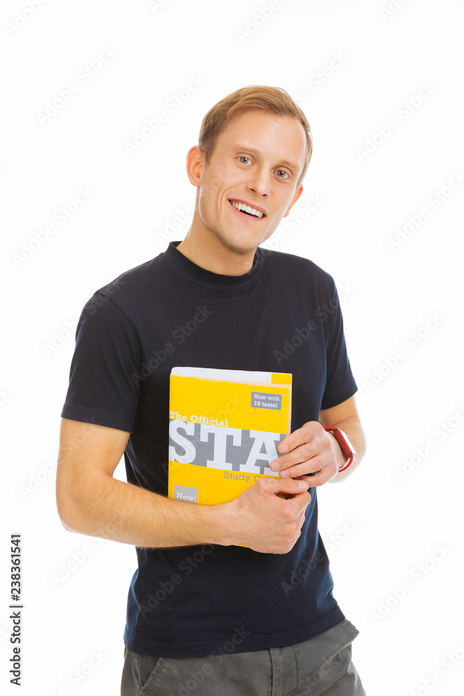 Cheerful positive male student smiling to you Cheerful positive male student smiling to you