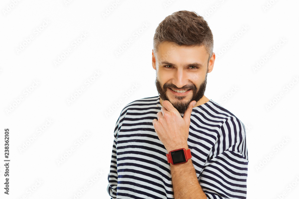 Joyful attractive young man touching his beard Joyful attractive young man touching his beard