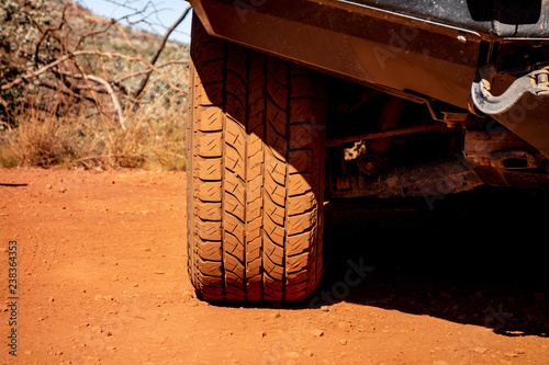 The detail of an off-road tyre on a Japanese 4x4 car photo