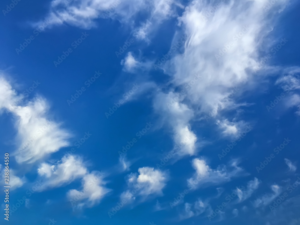 beautiful, unusual clouds in the afternoon against the blue sky