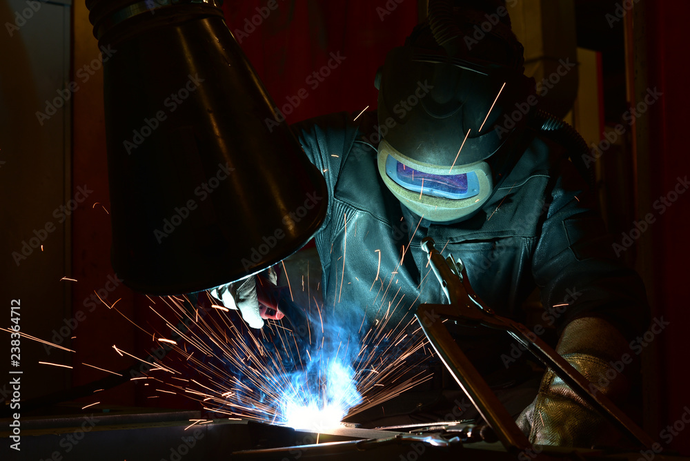 Industrial steel welder in factory welder, craftsman Industrial steel welder in factory welder, craftsman