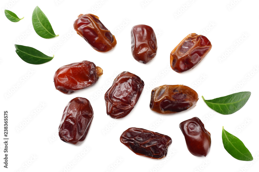 date fruits with green leaves isolated on white background. top view date fruits with green leaves isolated on white background. top view