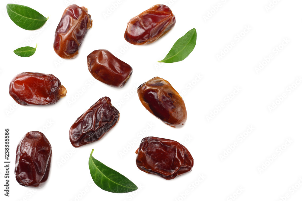 date fruits with green leaves isolated on white background. top view date fruits with green leaves isolated on white background. top view