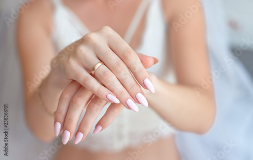 Close-up Woman showing her hands with beautiful manicure.Bride s hands with a nice manicure