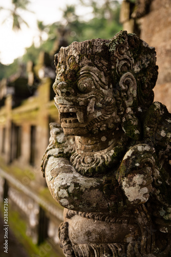 Stone carved demons protecting the staircase entrance of Pura Kehen hindu temple in Bali, Indonesia. photo