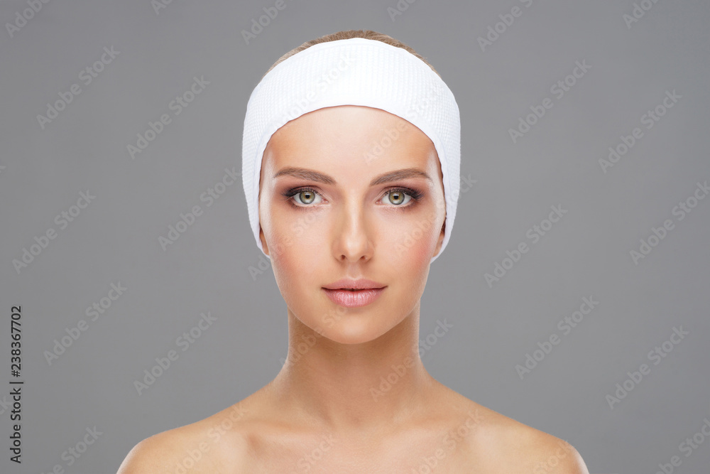 Doctor injecting in a beautiful face of a young woman. Plastic surgery concept. Doctor injecting in a beautiful face of a young woman. Plastic surgery concept.