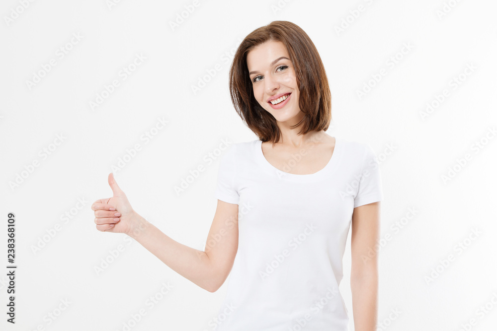Young caucasian woman in template blank t shirt showing big thumb up isolated on white background. Happy and success concept. Copy space - obrazy, fototapety, plakaty 