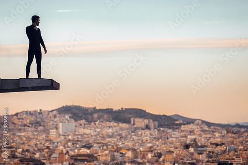 Photography Boy ready to jump from trampoline at sunset
