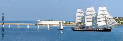 A procession of sailboats