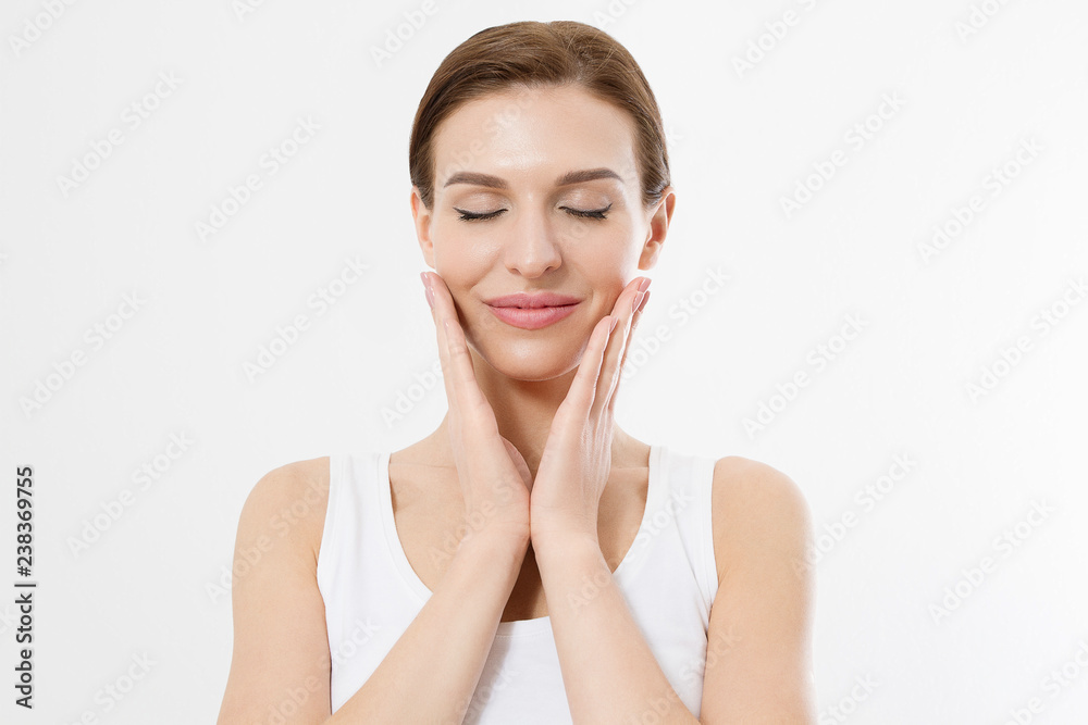 Young beautiful woman with closed eyes touching clean fresh face skin . Anti aging concept. Facial treatment . Cosmetology , Beauty and spa. Isolated on white Young beautiful woman with closed eyes touching clean fresh face skin . Anti aging concept. Facial treatment . Cosmetology , Beauty and spa. Isolated on white