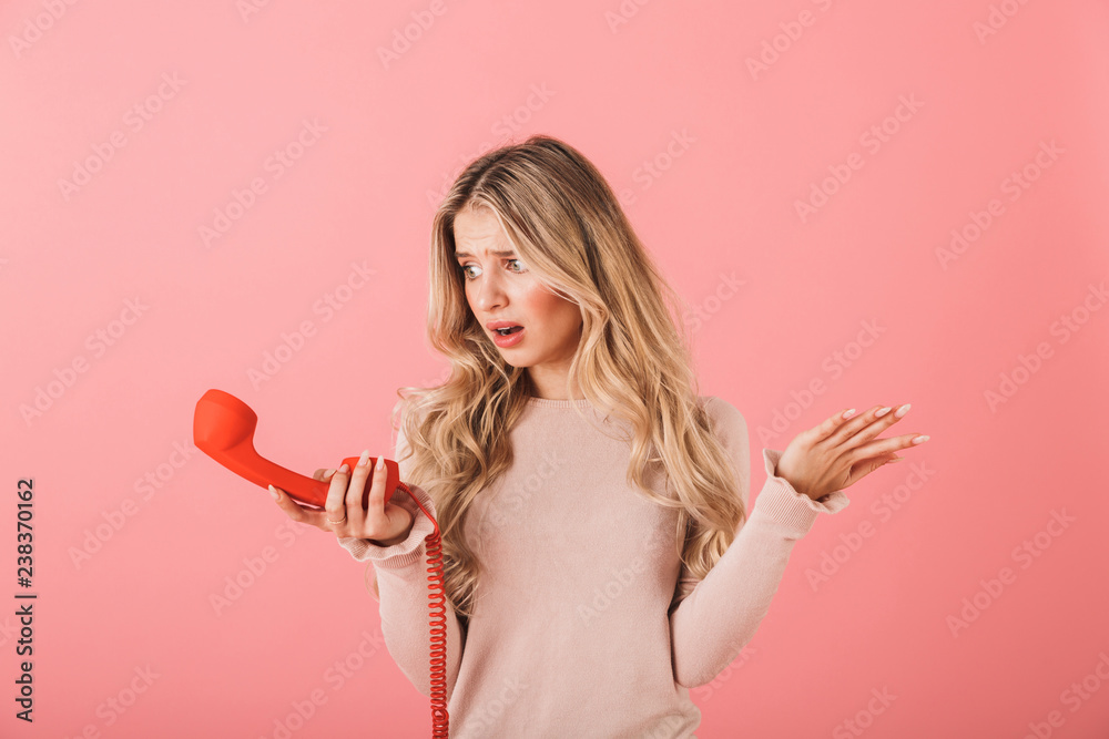Confused young blonde woman wearing sweater Confused young blonde woman wearing sweater