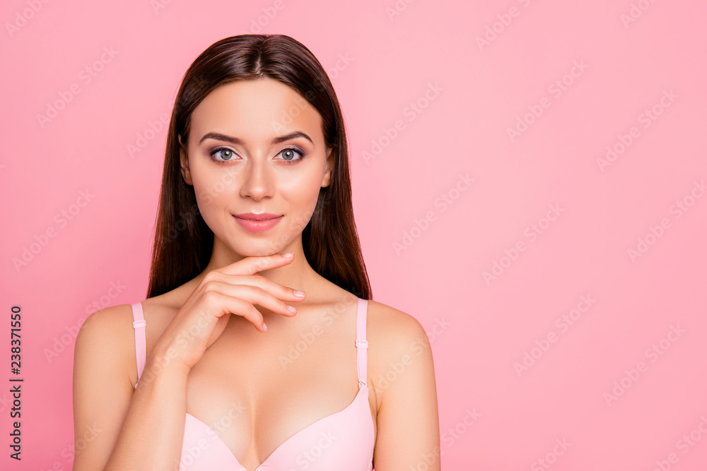 Close up portrait of attractive gorgeous tender brunette finger touching chin showing rejuvenation result her she woman wearing pale pink bra isolated on rose background Close up portrait of attractive gorgeous tender brunette finger touching chin showing rejuvenation result her she woman wearing pale pink bra isolated on rose background