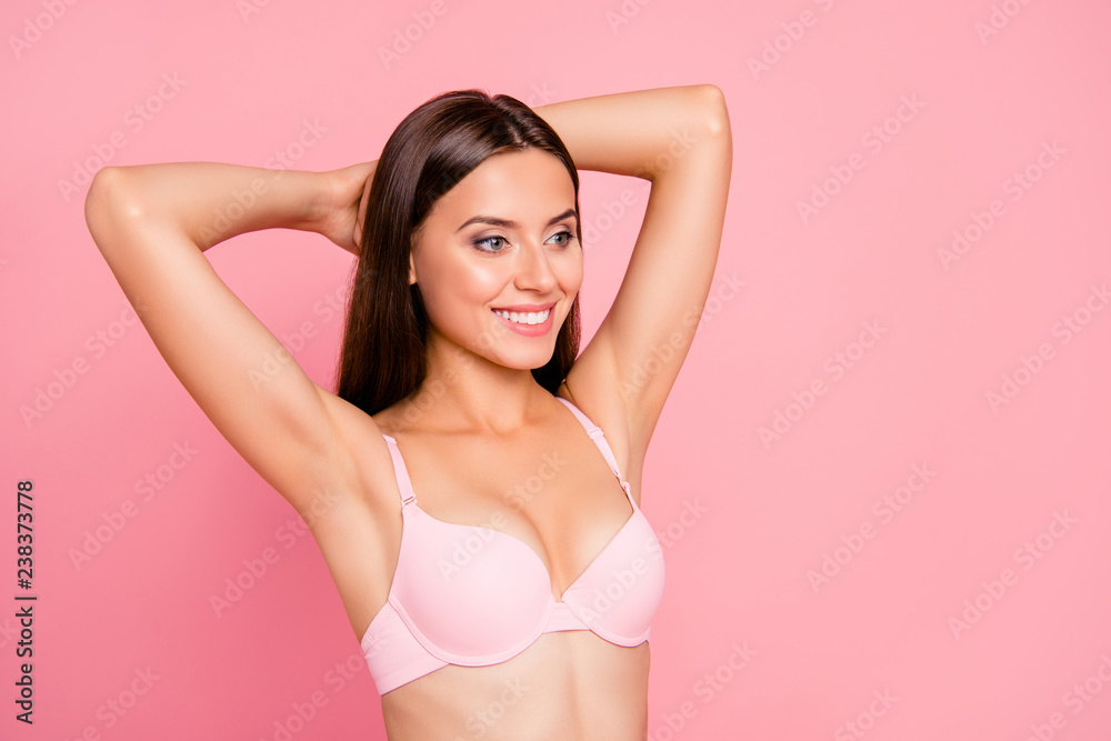 Portrait of nice cute attractive lovely sweet delicate tender cheerful  healthy girl in beige bra perfect shape form line curves chest enjoying  lifestyle isolated over pink pastel background Stock Photo