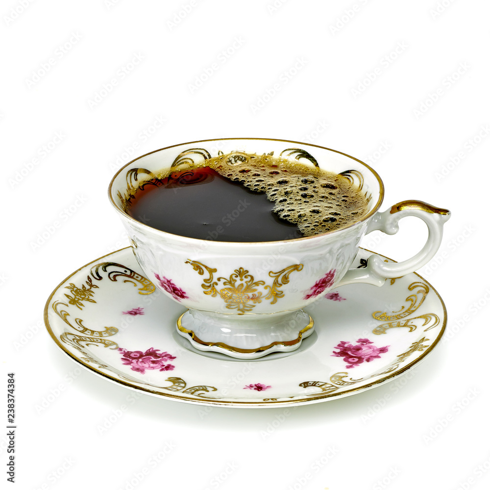 Coffee in antique porcelain cup isolated on white background including clipping path Coffee in antique porcelain cup isolated on white background including clipping path