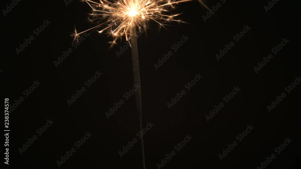 Sparkler burning down in the dark. Sparkler burning down in the dark.