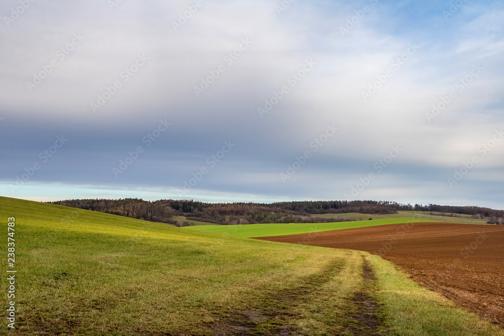 Autumn countryside with field, forest and blue sky Autumn countryside with field, forest and blue sky
