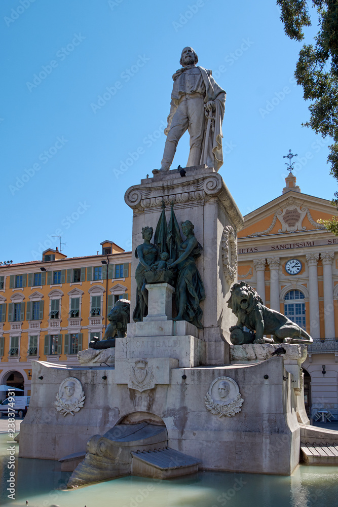 France. Nice. Piazza Garibaldi. Monument of Garribaldi. Against the background of the Chapel of the Holy Sepulcher
