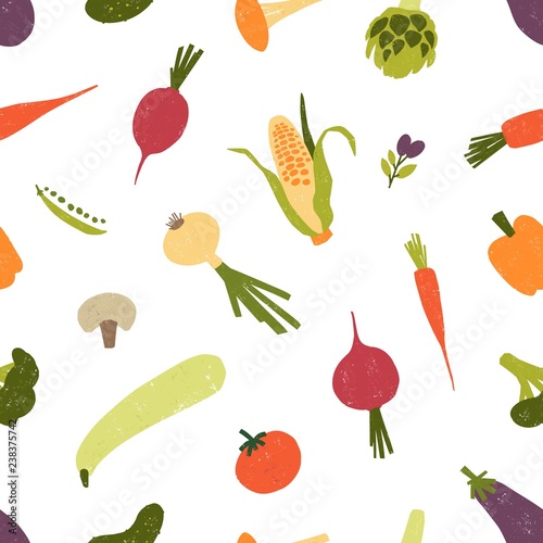 Seamless pattern with fresh organic vegetables or harvested crops scattered o...