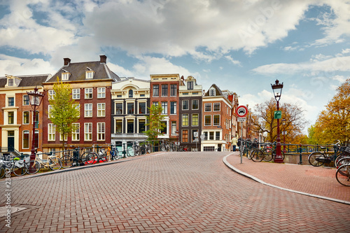 Photography Amsterdam, Netherlands. Bridge with bicycles along road on water