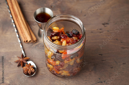 Mixed dry fruits soaked with spices in rum for traditional Christmas Cake photo