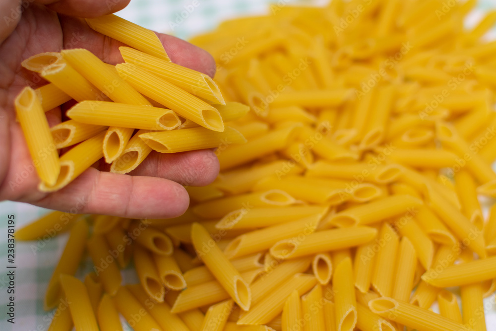 pasta are poured from the hand up the hill next to the table