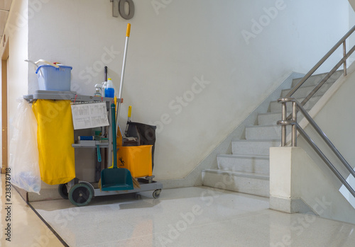 Cleaning tools cart wait for cleaner.Bucket and set of cleaning equipment in the apartment. janitor service janitorial for your place. Concept of service, worker and equipment for cleaner