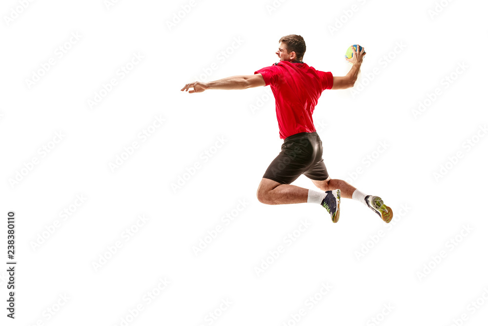 The fit caucasian young male handball player at studio on white background. Fit athlete isolated on white. The man in action, motion, movement. attack and defense concept