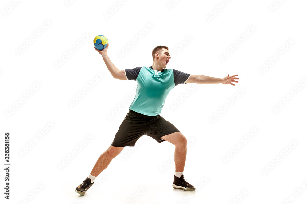 The fit caucasian young male handball player at studio on white background. Fit athlete isolated on white. The man in action, motion, movement. attack and defense concept