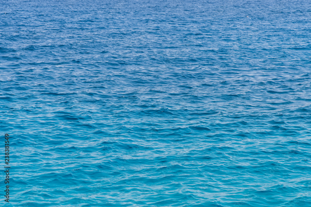 Blue sea background. Blue sea surface with waves Blue sea background. Blue sea surface with waves