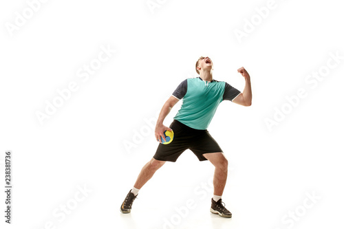 The happy fit caucasian young male handball player at studio on white background. Win, winner, human emotions concept © master1305