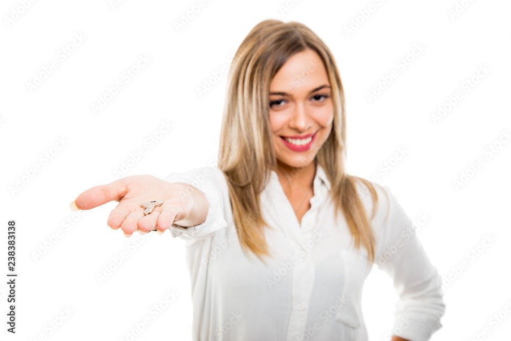Selective focus beautiful business real estate woman handing apartment key Selective focus beautiful business real estate woman handing apartment key