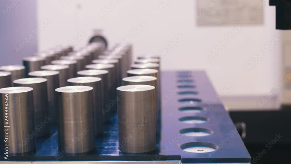 Industrial production. CNC machine is made of a metal cylinders Industrial production. CNC machine is made of a metal cylinders