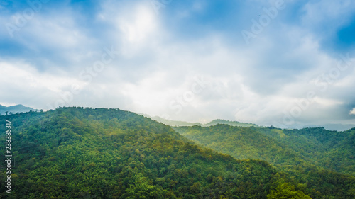 timelapse vdo for landscape concept from beautiful movement of cloud with sunbeam on layer of mountain and tree background on autumn season