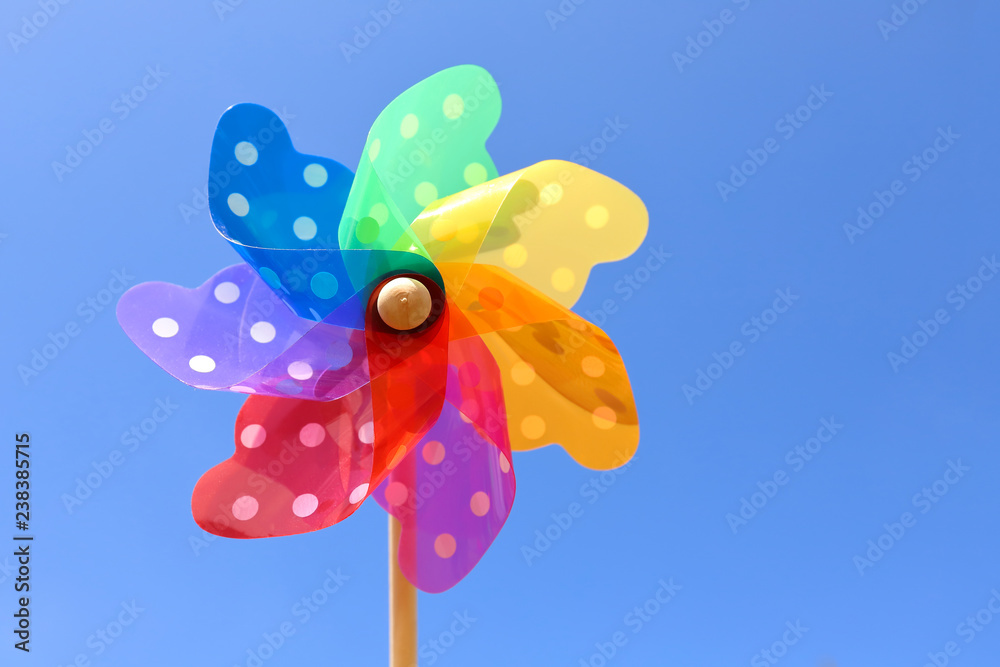 Wind turbine play with blue sky background.