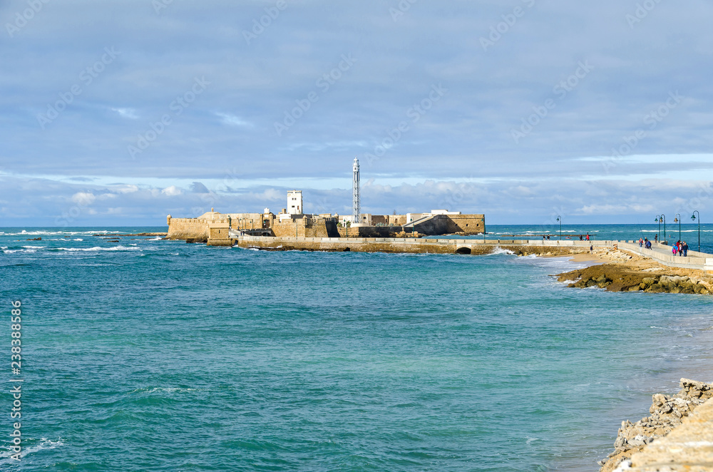 Castle of San Sebastan with its lighthouse in Cadiz, Spain