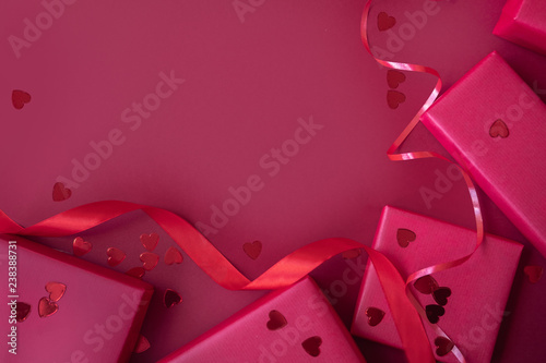Red presents on pink background. Mother's, Womens, Wedding, Happy st Valentines Day concept, 14th February. Top View, copy space, close up