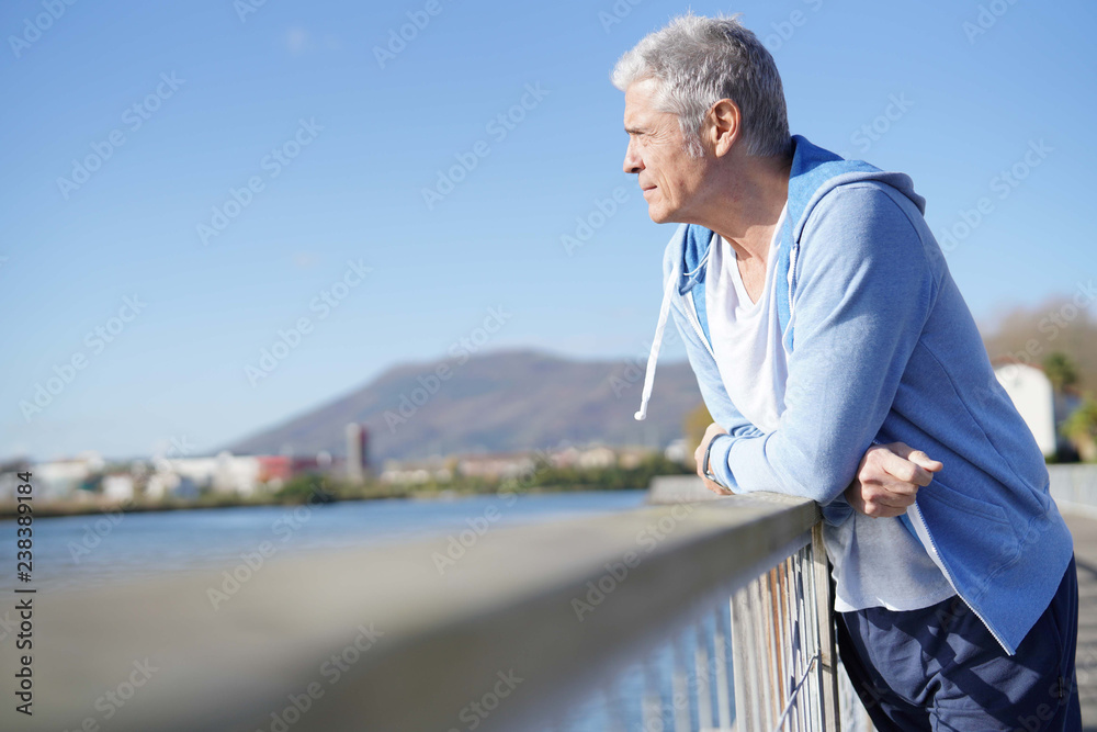 Relaxed senior man outdoors in sportswear Relaxed senior man outdoors in sportswear