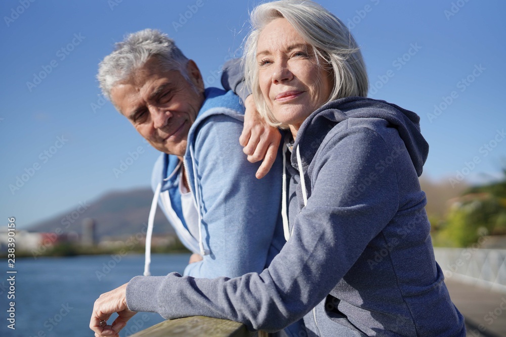  Senior couple in sportswear enjoying the sun outdoors