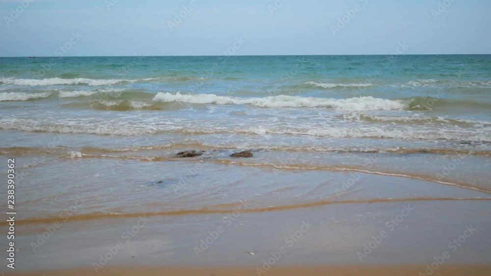 Sea wave and the beach with blue sky Sea wave and the beach with blue sky