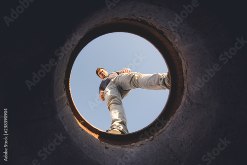 man looking through hole photo