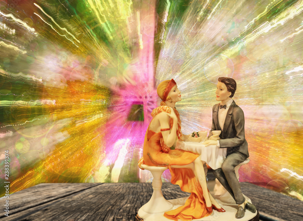 doll of young couple in love having dinner with colorful light,valentine concept