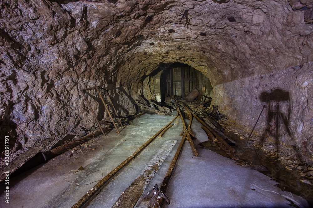 Naklejka premium Underground abandoned gold iron ore mine shaft tunnel gallery passage