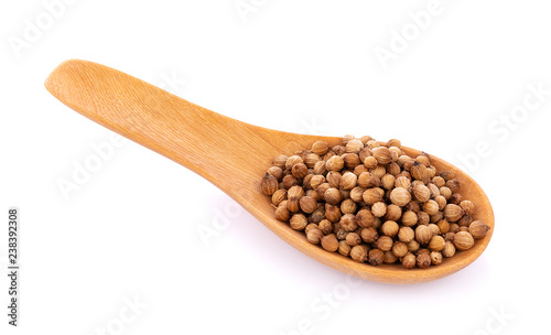 coriander seeds in spoon wooden on white background