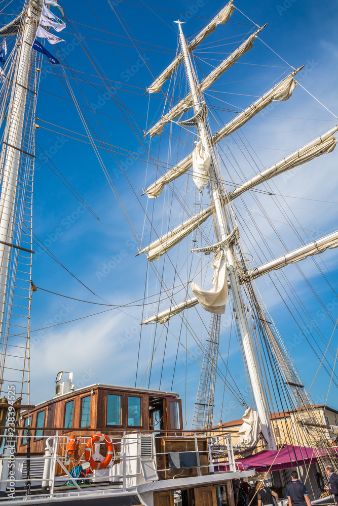 Obraz premium Nave Italia ship of the Italian navy with ropes and equipment on the bridge on the port of Livorno. Nave Italia is the biggest sailing brig in the world