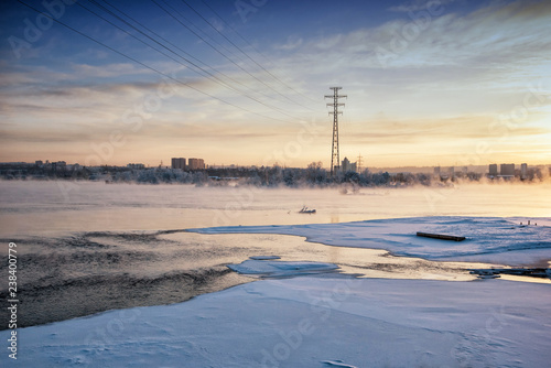 Winter Angara. The city embankment of the Angara River on a Sunday sunny winter day. Winter Irkutsk